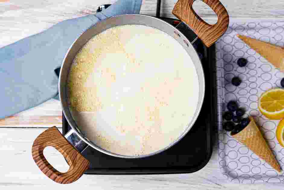 Blueberry Ice Cream Recipe: Scrape the warmed yolk mixture back into the saucepan with the heavy cream mixture.