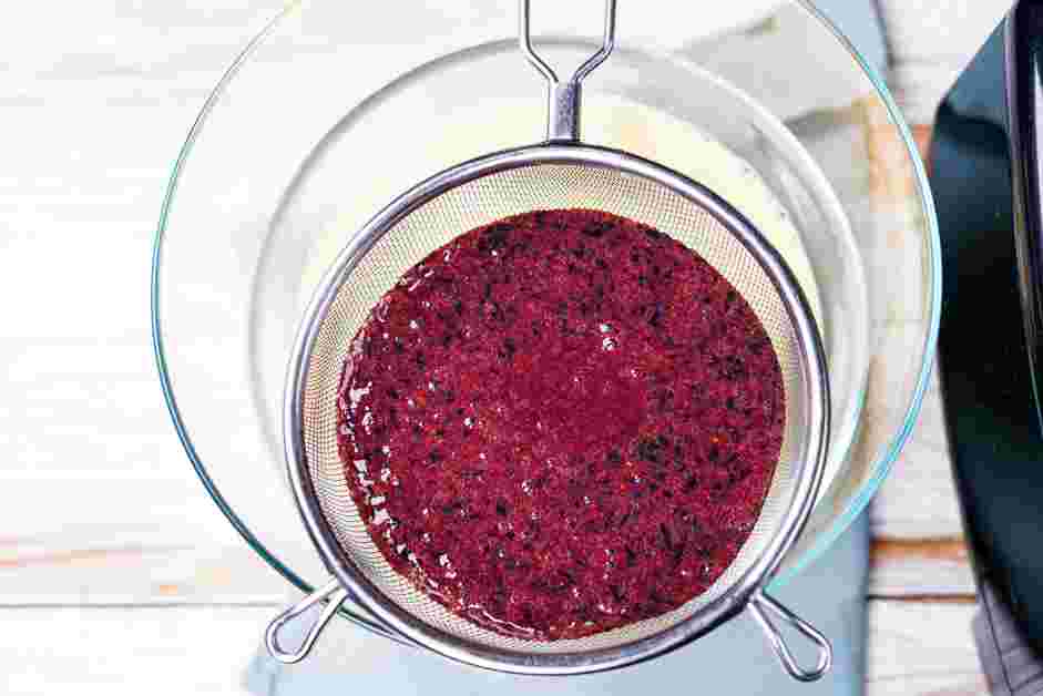 Blueberry Ice Cream Recipe: Strain the blueberry puree through a fine-mesh strainer into the custard base.