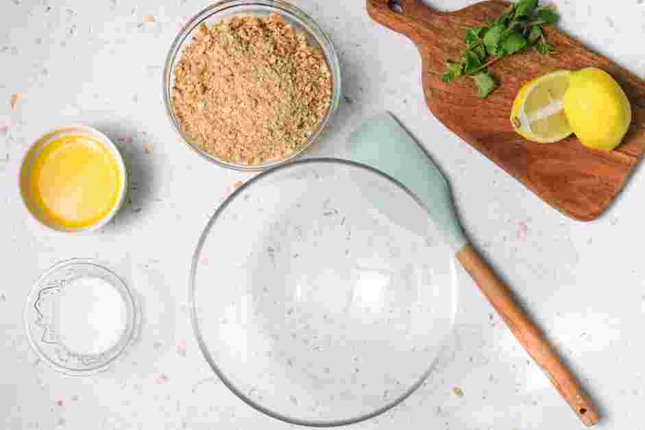 Lemon Cheesecake Bars Recipe: In a bowl, whisk together the graham cracker crumbs, sugar and salt.