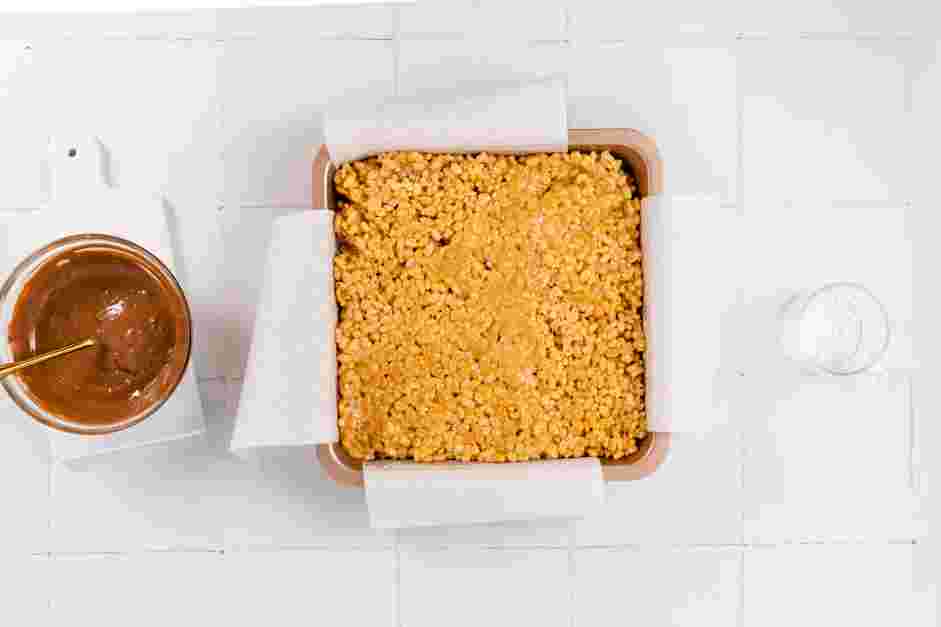 Peanut Butter Rice Krispie Treats Recipe: Transfer the mixture to the prepared baking pan.