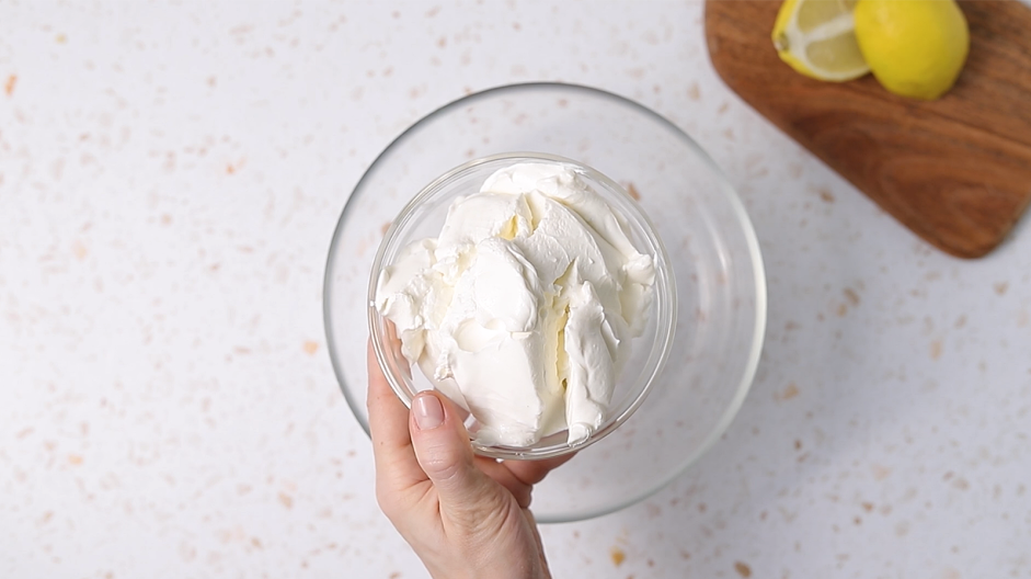 Lemon Cheesecake Bars Recipe: While the crust is cooling, make the filling.