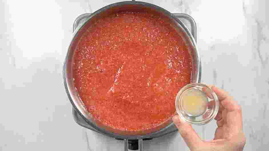 Strawberry Crunch Cake Recipe: In a small pot over medium heat, add the strawberry puree and the lemon juice.